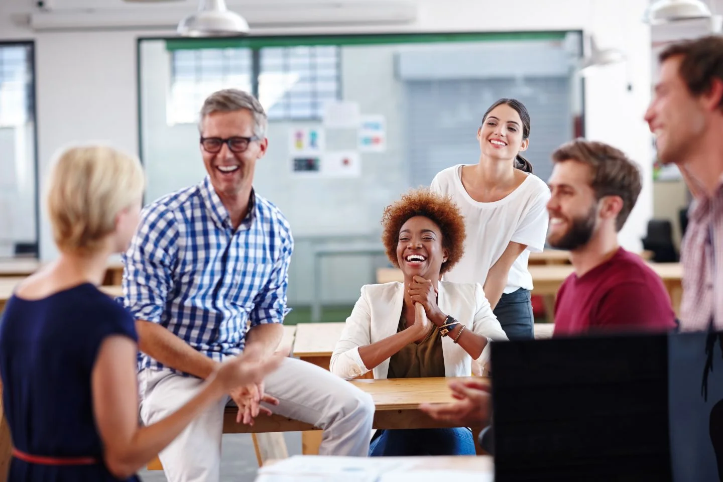 people at work laughing