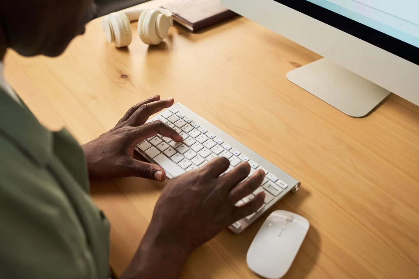 person typing on a keyboard