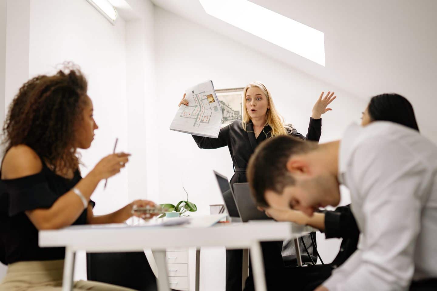 boss stressed while communicating with equally stressed employees